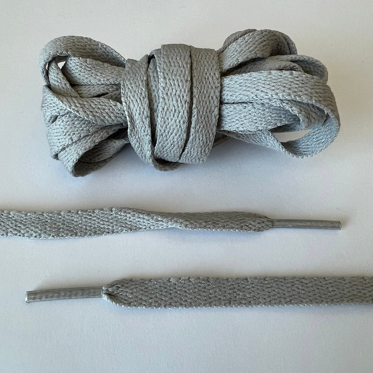 Grey trainer sale laces